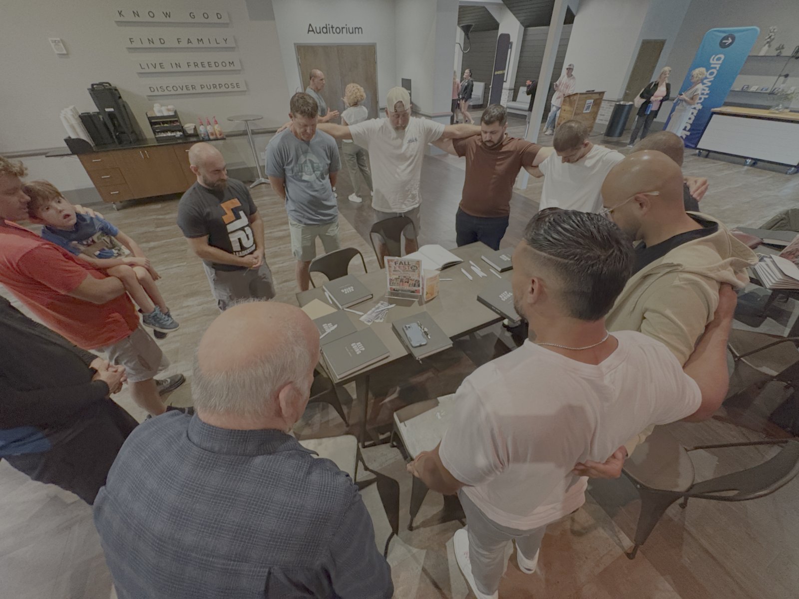 The first Keep Going small group praying together at Bayside Community Church